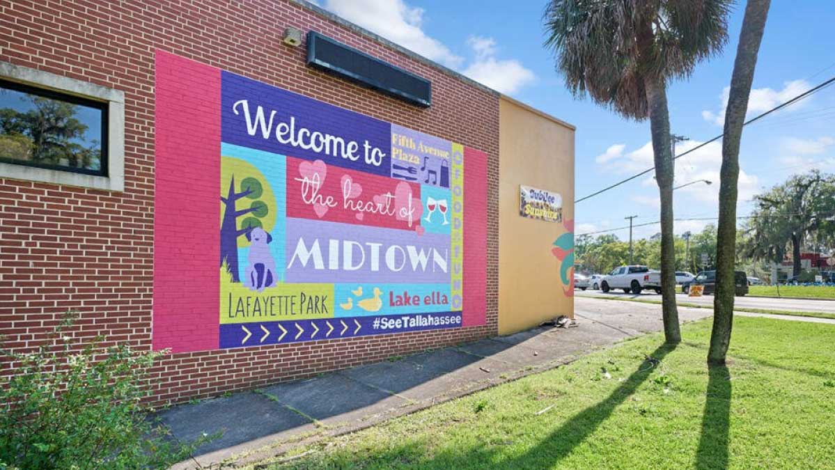 A mural on the side of a brick building for Midtown; a neighborhood in Tallahassee